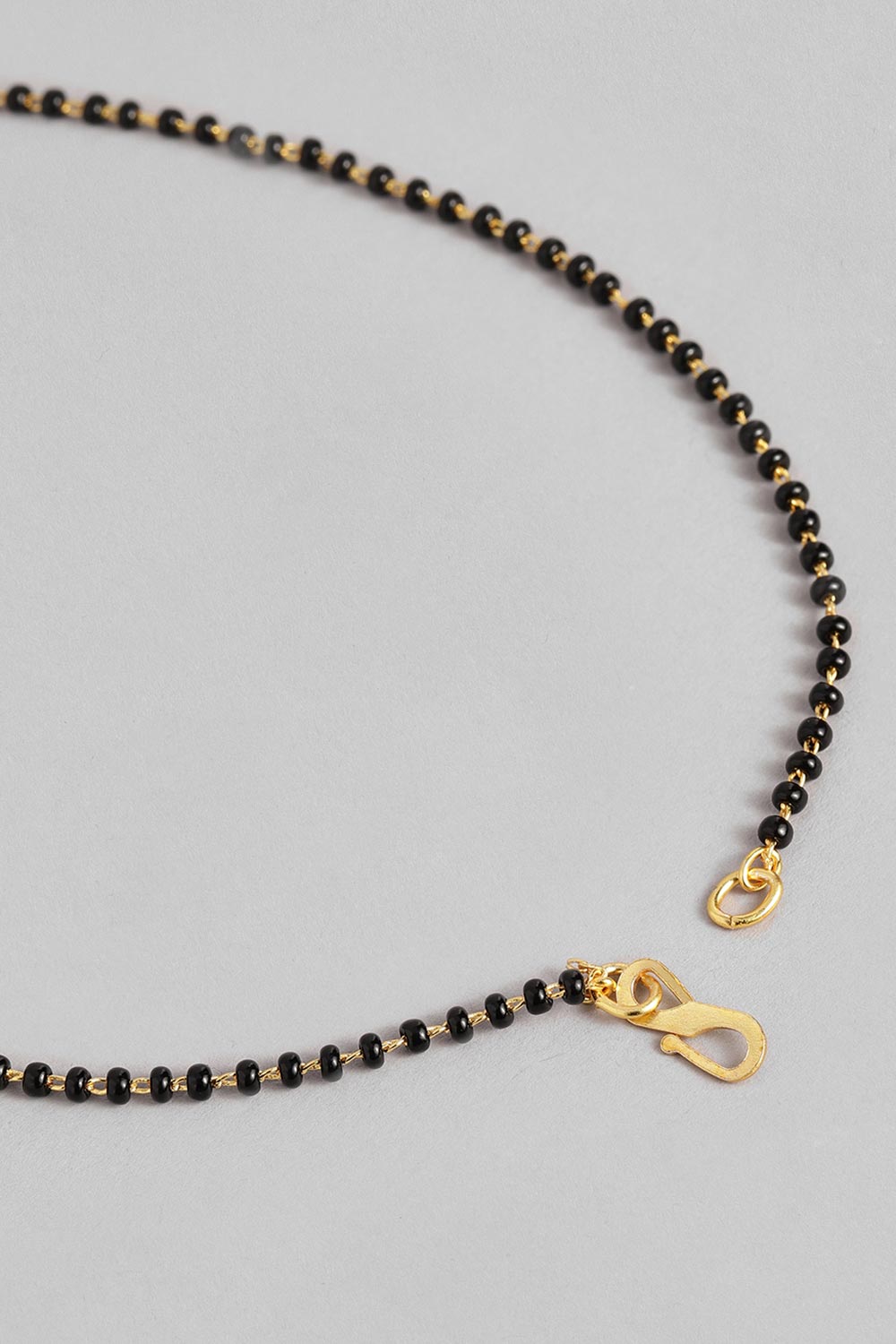 Gold Plated American Diamond And Black Beaded Mangalsutra