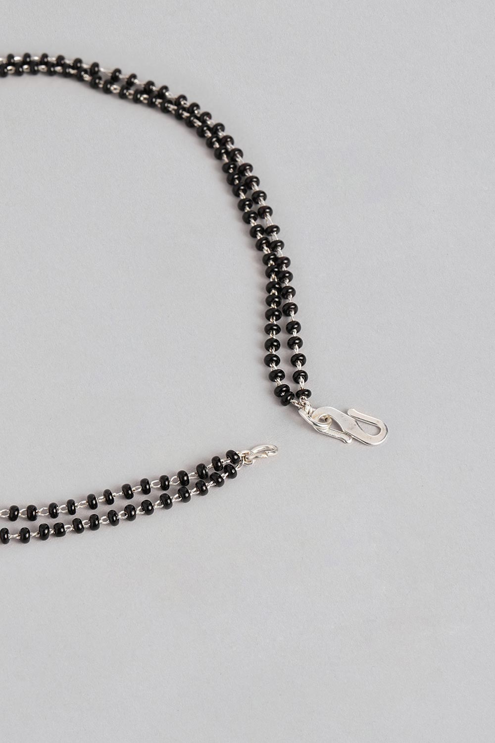 Silver Plated American Diamond And Black Beaded Mangalsutra