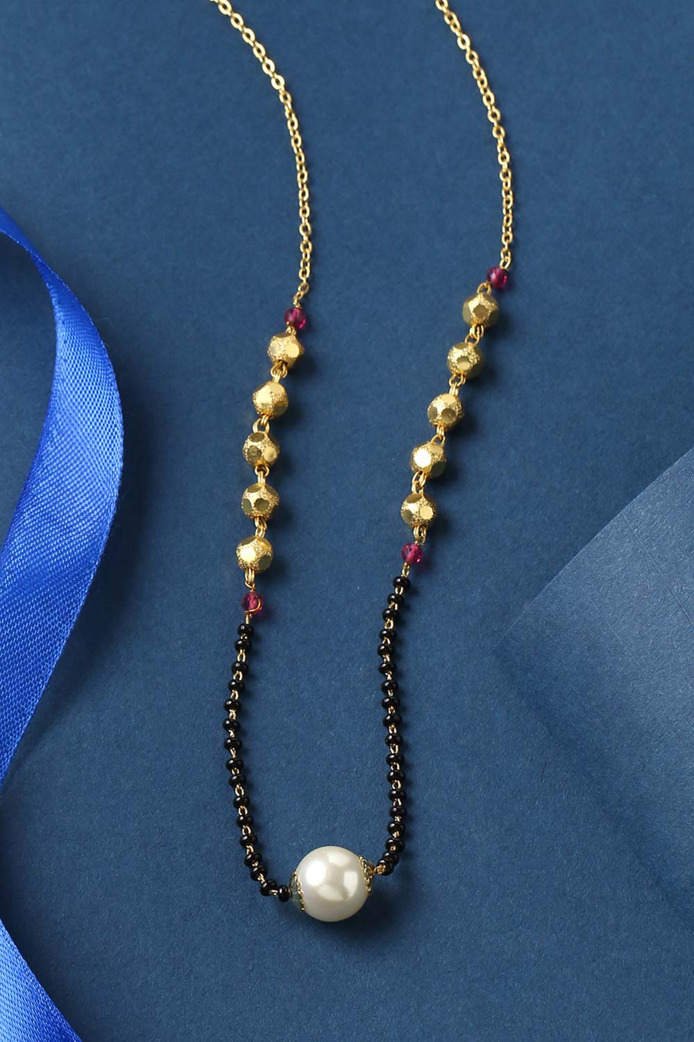 Buy Gold plated And Black Beads Ad Studded Pearl Mangalsutra Online