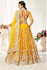 Net Embroidery Lehenga Choli in Yellow - Back