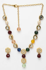 Red And Blue Gold-Plated Kundan And Pearls Necklace Earring Sets with white backround
