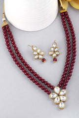 Maroon Gold Plated Kundan And Pearl Studded Necklace Jewelry Set