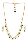 Alloy Kundan Neckpiece With Earrings In Gold And White