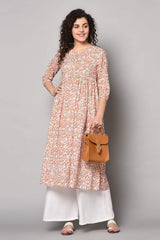 Buy Blended Cotton Floral Kurti in White and Orange